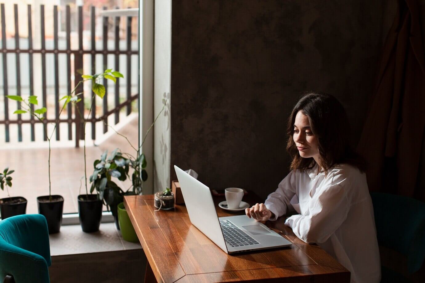 woman-coffee-shop-working-laptop_23-2148366698